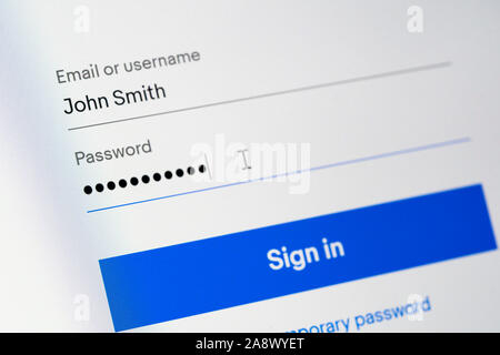 A log in screen requiring a username or email address and a password, with a sign in button. The username given is John Smith. United Kingdom Stock Photo