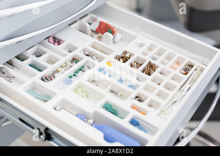 Close up of colorful dental tools in open storage Stock Photo