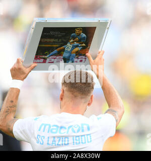Ciro Immobile of SS Lazio poses with the award received for 100 goals scored with his team during the Serie A match between Lazio and Lecce at Stadio Olimpico, Rome, Italy on 10 November 2019. Photo by Giuseppe Maffia. Stock Photo