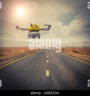 yellow drone for expeditions flies over an isolated road in the middle of the desert. worldwide shipping concept. Stock Photo