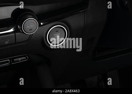 Modern car on/off push button switch. Stock Photo