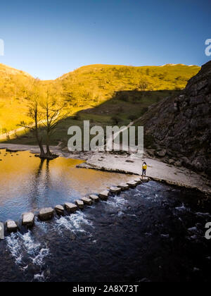 Aerial views of the stunning Dovedale stepping stones and mountains in the glorious Peak District national park, the meandering river Dove flowing Stock Photo