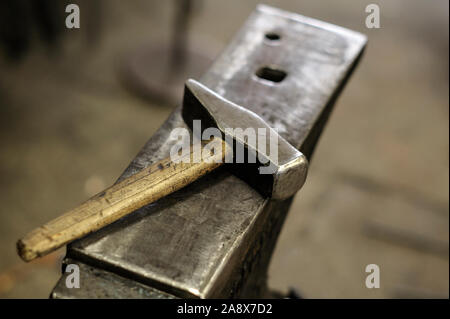 Anvil and hammer, blacksmith tools in the forge Stock Photo