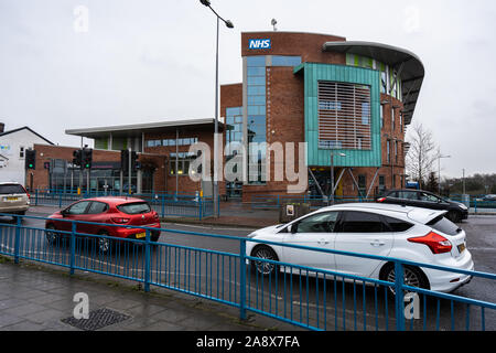 Cars pass the Meir Medical Centre run by the NHS, doctors and dentists medical care at all hours Stock Photo