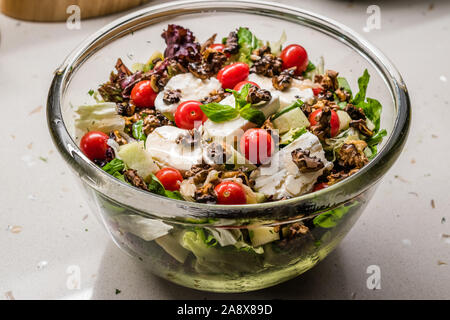 Goat Cheese Salad with Roasted Walnuts,  Cherry Tomatoes and Diced Apple Cubes. Organic Fresh Food. Stock Photo