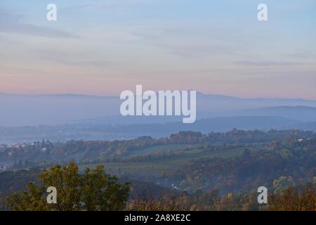 Schneeberg on an autumn morning, view from Kahlenberg, Wien, Austria. Foggy morning with pink sky. Stock Photo