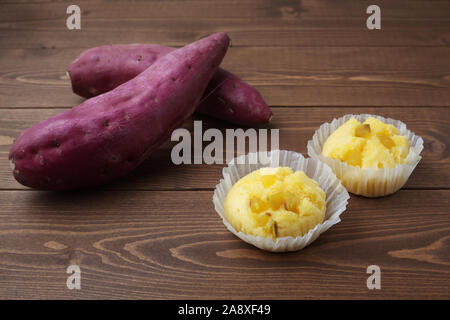 sweet potato steamed bread cupcake muffin isolated on table Stock Photo