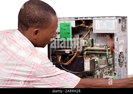 technician opens the computer hardware and verifies it. Stock Photo