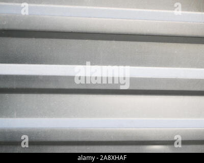 Metal fence close-up. Ribbed gray. Place for an inscription. background for the project. Stock Photo