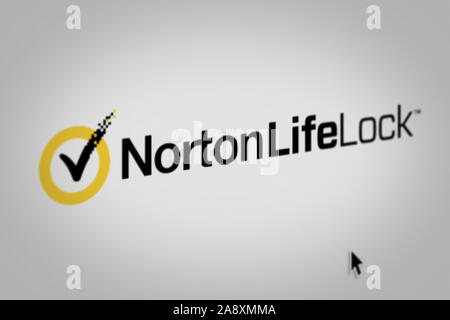 Logo of the public company NortonLifeLock displayed on a computer screen in close-up. Credit: PIXDUCE Stock Photo