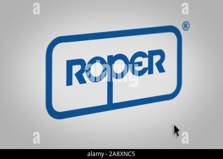 Logo of the public company Roper Technologies displayed on a computer screen in close-up. Credit: PIXDUCE Stock Photo