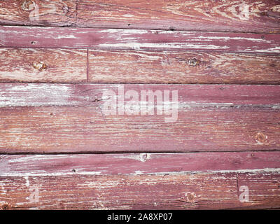 old red wall made of wood. An old painted surface made of wood for design and creativity. Texture of an old red painted board made of wood for Stock Photo