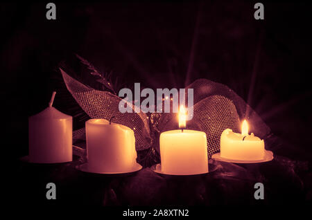 two from four advent candles burning Stock Photo
