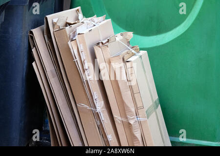 Cardboard and waste paper is collected and packaged for recycling. Cardboard is bundled into bales. Urban Recycling. Stock Photo