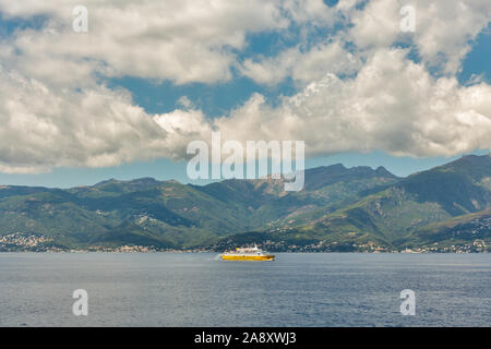 CORSICA, FRANCE - JULY 12, 2019: Corsica Ferries - Sardinia Ferries ship sailing in the sea with dramatic clouds. It is a ferry company that operates Stock Photo