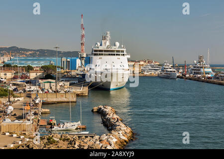 LIVORNO, ITALY - JULY 23, 2019: Seven Seas Voyager luxury cruise ship for Regent Cruises moored in port. Every cabin on board is a suite with a balcon Stock Photo