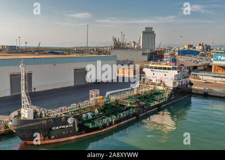 LIVORNO, ITALY - JULY 23, 2019: Capraia industrial oil products tanker ship moored in port. It was built in 2007 and it is sailing under the flag of I Stock Photo