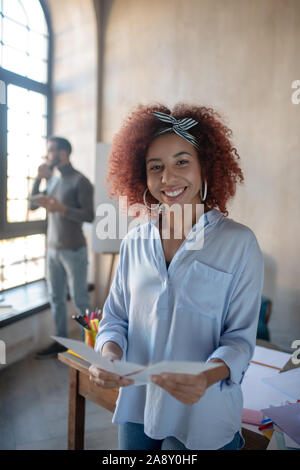 Beautiful promising interior designer feeling motivated Stock Photo