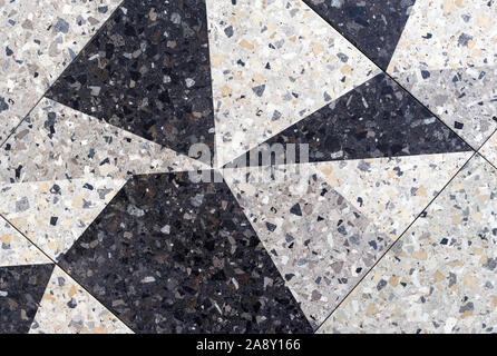 Gray porcelain tiles with geometric patterns. Background and texture of porcelain tiles. Stock Photo