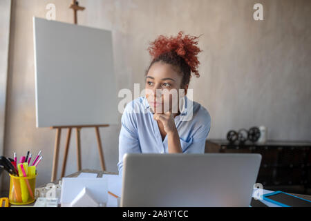 Designer feeling thoughtful while having little break Stock Photo