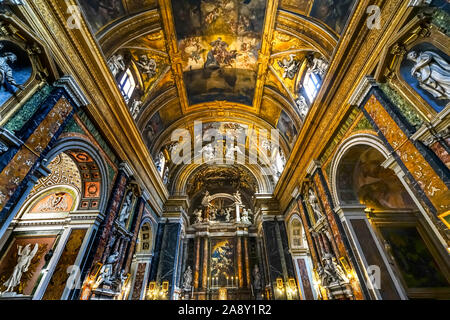 Altar Statues Frescoes Basilica Jesus and Mary Gesu e Maria Church Rome Italy.  Built in the 1600s Coronation of Mary Painting 1679 by Giacinto Brandi Stock Photo