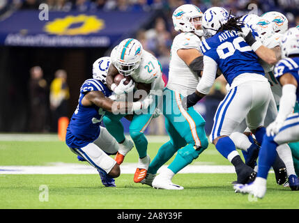 Indianapolis, Indiana, USA. 10th Nov, 2019. Miami Dolphins running back Kalen Ballage (27) runs with the ball as Indianapolis Colts linebacker Darius Leonard (53) attempts to make the tackle during NFL football game action between the Miami Dolphins and the Indianapolis Colts at Lucas Oil Stadium in Indianapolis, Indiana. Miami defeated Indianapolis 16-12. John Mersits/CSM/Alamy Live News Stock Photo