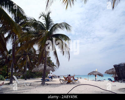 Varadero, Cuba - April, 30 2012: People relaxin along the beach on Varadero Peninsula, Matanzas Province, Cuba. Stock Photo