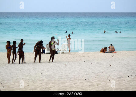 Varadero, Cuba - April, 30 2012: A group of women along the beach on Varadero Peninsula, Matanzas Province, Cuba. Stock Photo