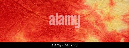 red, yellow decorative packing paper crumpled and wrinkled, panoramic banner, Stock Photo