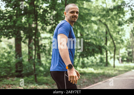 Sportsman before start running in the city park Stock Photo