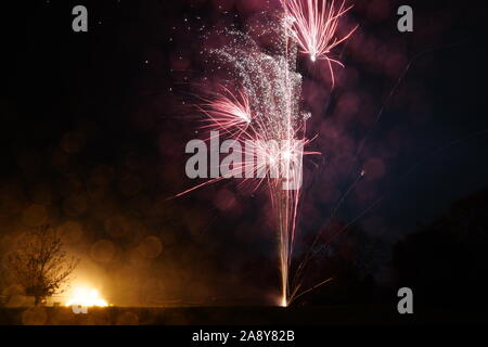 Fireworks above a bonfire Stock Photo