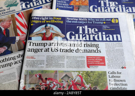 'Trump arrives amid rising anger at US trade demands' newspaper headlines in the Guardian 3 June 2019 in British newspaper London England UK Stock Photo