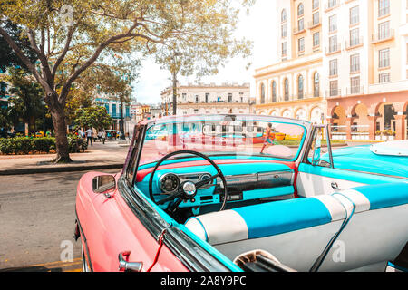 Pink old american classic car in Havana, Cuba