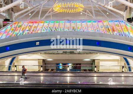 Colorful neon lights decorate a people mover at Denver International Airport; Denver; Colorado; USA Stock Photo