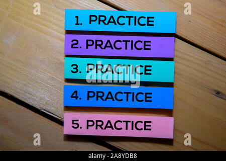 Practice. Practice. Practice. Practice. Practice text on sticky notes isolated on the tables Stock Photo