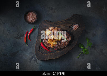 Grilled chuck roll steak on wooden board. Stock Photo