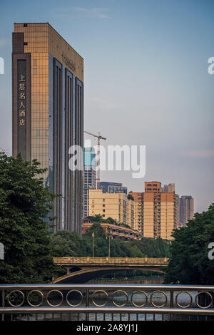 Chengdu, China -  July 2019 : High-rise building commercial hotel and bridges over Jin river in Chengdu city, Sichuan Province Stock Photo