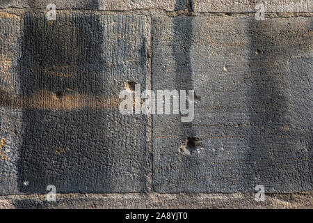 Close-up of bullet holes and shrapnel damage from the Second World War, on the exterior of St. Lorenz Kirche in the historic city of Nuremberg, German Stock Photo