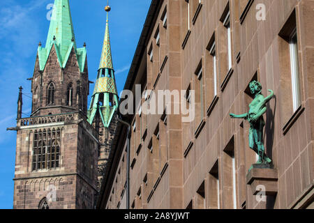 A view passed the architecture of Konigstrasse towards the spires of St. Lorenz Kirche in the city of Nuremberg in Germany. Stock Photo