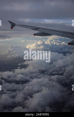 Views from our Airbus A320 flying out from Gibraltar to Heathrow, of cloudscapes while the sun set Stock Photo