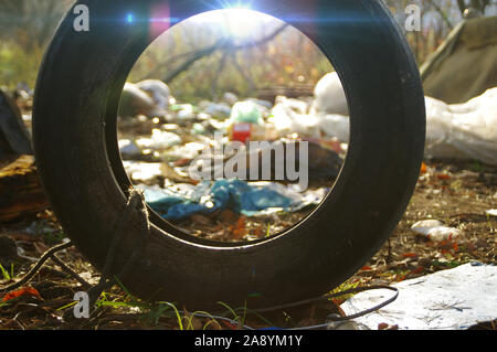 Heap of plastic garbage in the forest. Environmental protection concept. Stock Photo