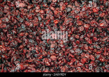 sweet chewy brown raisin fruit  in a bin ready for eating Stock Photo