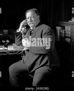 William Howard Taft talking on telephone ca. 1905-1930 Stock Photo