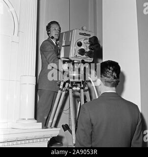 The first broadcast of the Finnish Independence Day celebrations, 6.12.1957. This picture is taken in the presidential residence in Helsinki. Cameraman Pentti Valkeala is testing German Fernseh GmbH's Orthicon camera, type KIO. Stock Photo