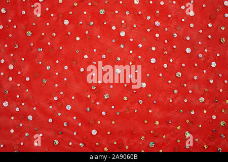 Red tulle with gold brilliant sequins Christmas, new year background Stock Photo