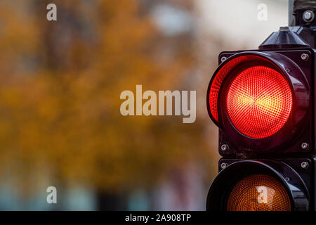 A city crossing with a semaphore. Red light in semaphore - image Stock Photo