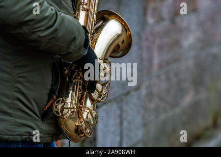 Close-up of a saxophone in street musician hands - image Stock Photo