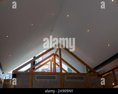 SEPTEMBER 28, 2019 : Bangkok, Thailand : Interior downlights on ceiling under the roof. Inside home with construction decorated with ceiling led dim l Stock Photo