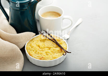 Vanilla custard bread pudding in a white ramekin Stock Photo