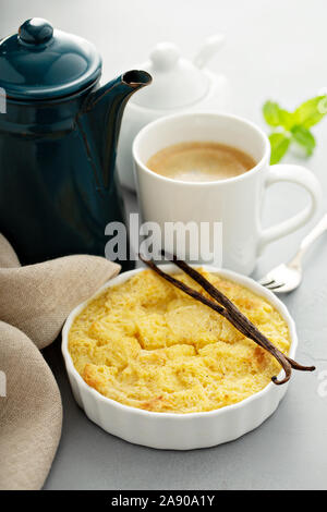 Vanilla custard bread pudding in a white ramekin Stock Photo